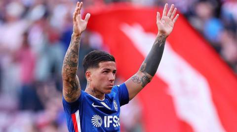 Enzo Fernandez appearing to wave goodbye to Chelsea supporters after defeat at Sunderland