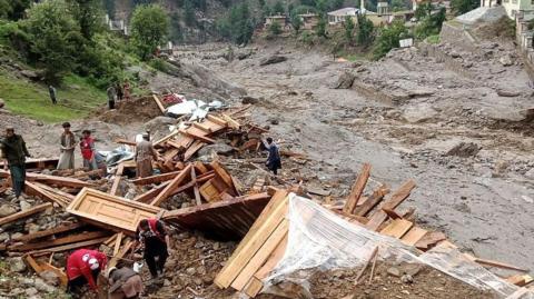 A view of damage as rescue members continue searching after severe flash floods struck Afghanistan's eastern Nuristan province on July 19, 2026