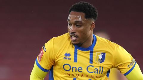 Victor Adeboyejo in action for Mansfield Town