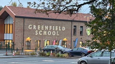 An external image of Greenfield School in Old Woking.