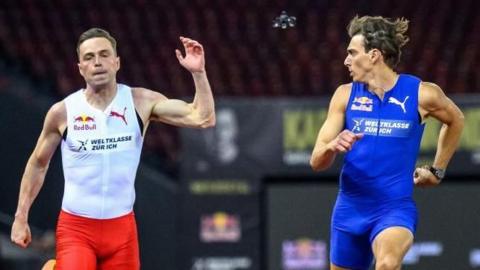 Sweden's Armand Duplantis turns to stare down Norway's Karsten Warholm as he beats him in a 100m exhibition race