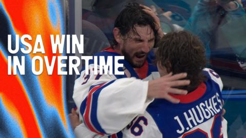 Jack Hughes and Connor Hellebuyck celebrating