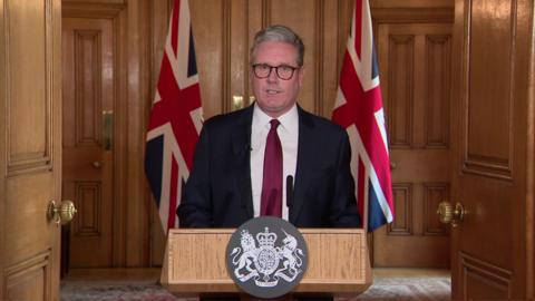 Keir Starmer addressing journalist during news conference