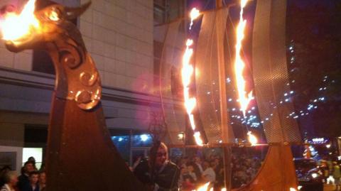 Torchlight procession featuring a Viking longboat in the 2012 Preston Guild