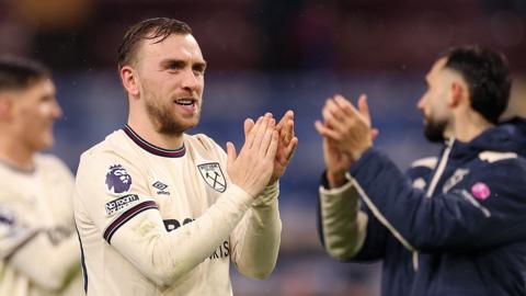 West Ham players clap after the game with Burnley