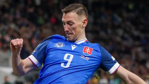 Robert Bozenik in action for Slovakia