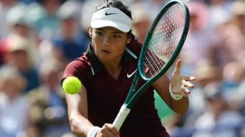 Emma Raducanu hits a backhand