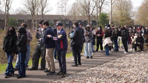 Students queue for meningitis vaccine