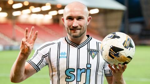 Dunfermline Athletic hat-trick scorer Chris Kane with the match ball