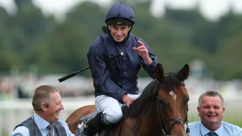 Ryan Moore salutes the crowd after winning the Juddmonte International Stakes on City Of Troy