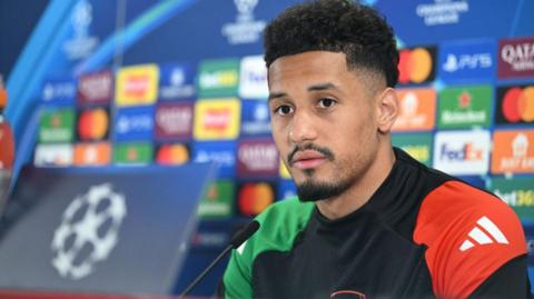 William Saliba at a news conference