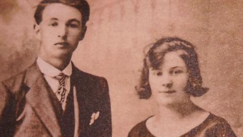 Sepia photograph of siblings Griff - wearing a suit and tie - and Patti Thomas together when they were young.