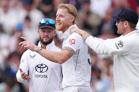 Ben Stokes points and smiles, with Ben Duckett and Liam Dawson either side of him