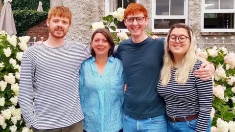 Jacqui and her family in the garden