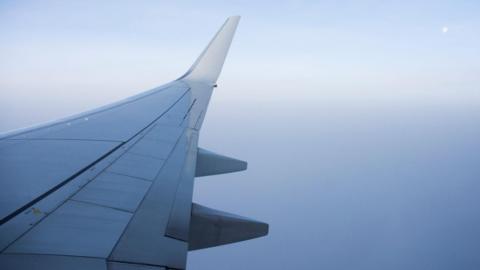 Airplane wing in fog