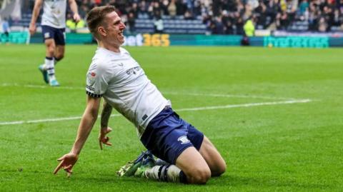 Emil Riis celebrates scoring by sliding on his knees