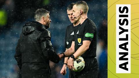 St Mirren manager Stephen Robinson in conversation with the match officials