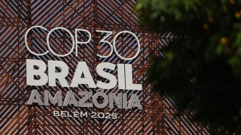 The COP30 sign with Brasil and Amazonia writing is seen through trees