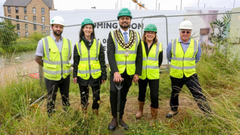 Mayor of Swindon Imtiyaz Shaikh puts a spade in the ground at new Wichelstowe development

 