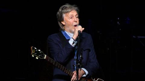 Paul McCartney singing on stage