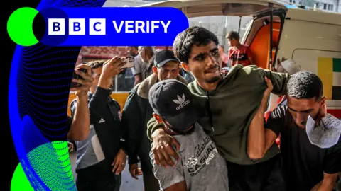 A Palestinian man is carried out of an ambulance and into the Nasser Hospital in Gaza