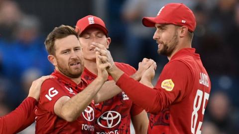 England players celebrate a wicket
