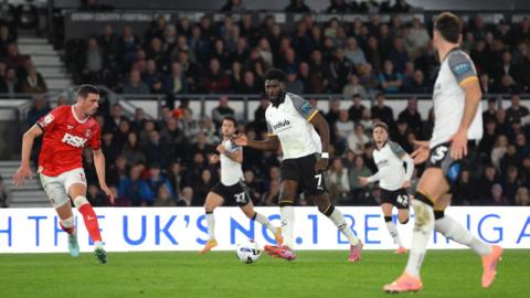 Derby County's Patrick Agyemang plays a pass during the game against Charlton