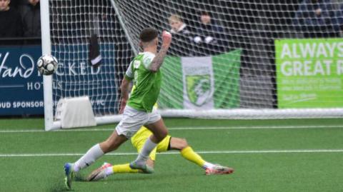 Sam Murray scoring for Guernsey FC.