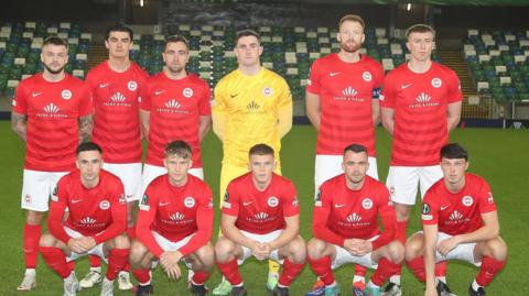 Larne team pose for a photograph before facing Shamrock Rovers