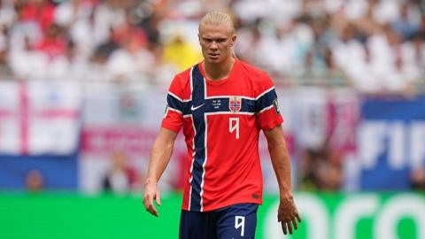 Erling Haaland looks down