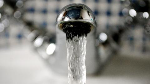 Stock picture of water coming out of a tap