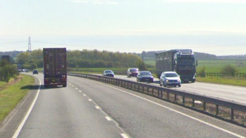 Google maps screen grab of the A14. Cars are on either side of the dual carriageways and are boardered by greenary. 