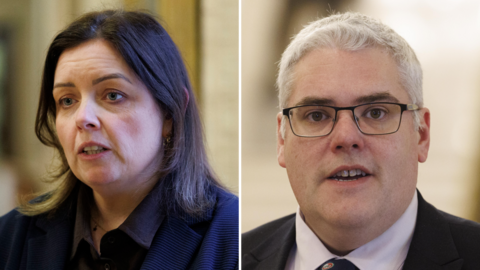 Deirdre Hargey is on the left of a composite image. She has long dark hair. On the right is Gavin Robinson who has short grey hair and is wearing glasses. 