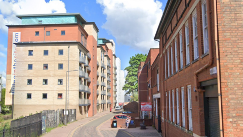 Bath Lane, Leicester, with high rise flats lining the side street