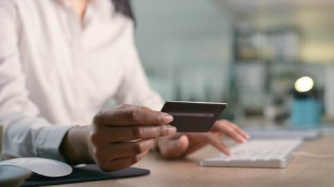 Woman uses card.