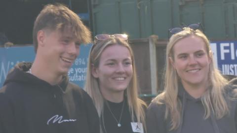 Lauren Hemp smiling at camera with fans