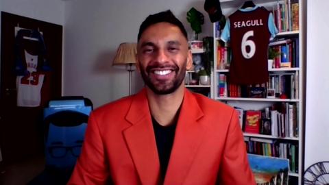 Bobby Seagull in a red jacket, smiling