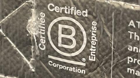 The B Corp logo on the inside of a bag