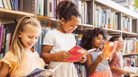 Children reading in a library.
