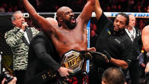 Jon Jones celebrates with UFC title