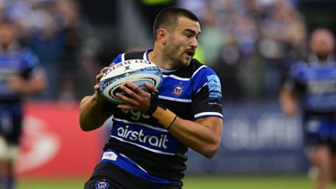 Will Muir runs with the ball in his hand during a match last season