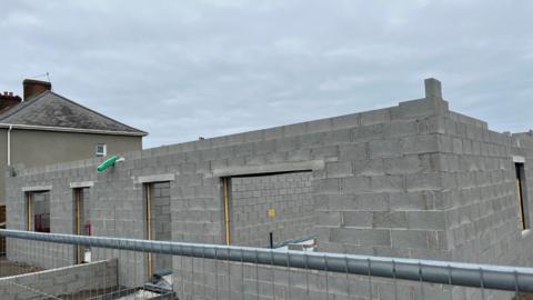 A housing development with a fence around it