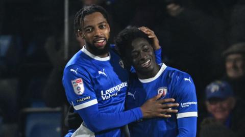 Michael Olakigbe of Chesterfield celebrates after scoring the team's third goal