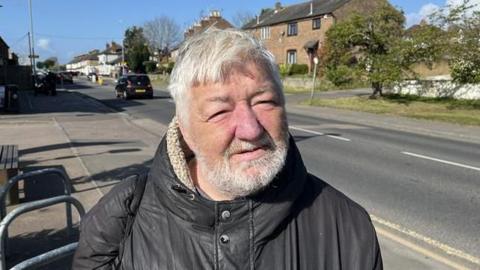 Michael Samson standing on main road in Maidstone