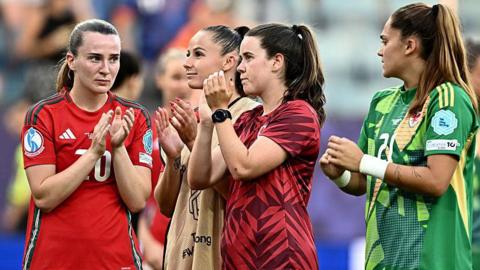 Wales players applaud their fans at the end of the game