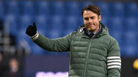 Burnley boss Scott Parker gives a thumbs up to their fans