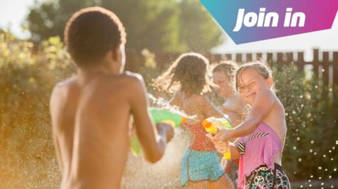 children having a water fight