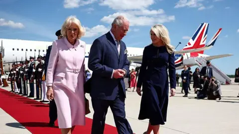 Britain's King Charles III and Queen Camilla are greeted by US Protocol Chief Monica Crowley .