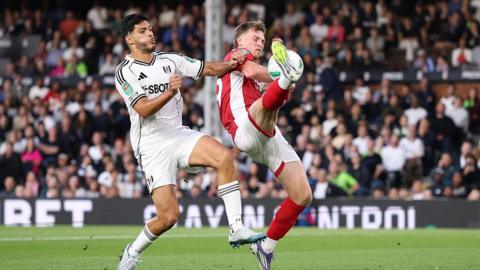Fulham's Raul Jimenez fights for the ball