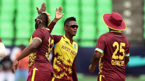 West Indies' Akeal Hosein celebrates a wicket against Papua New Guinea